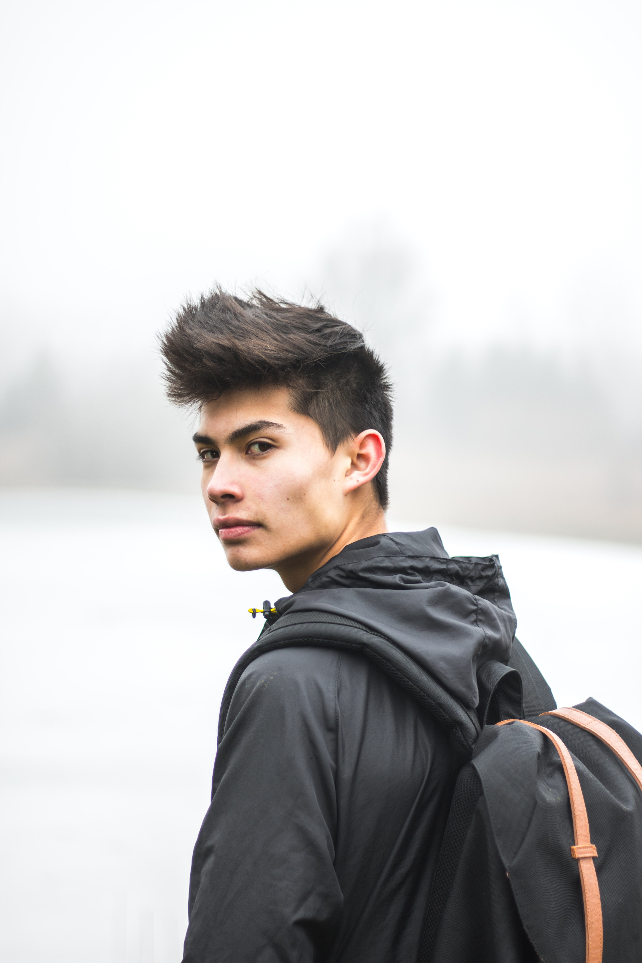 Photo of a male asian american teen looking at the camera. Is your teen struggling with big life transitions? With teen therapy in Marin County, CA our teen therapists can help help give them support.