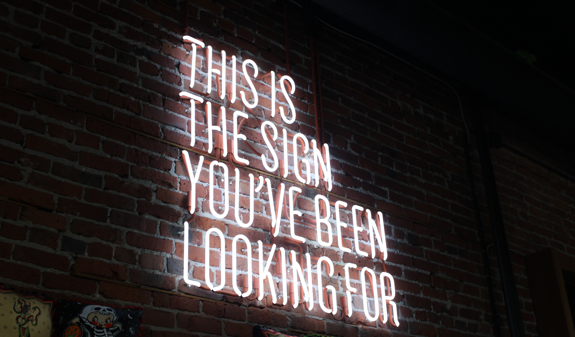 Photo of a neon sign on a brick wall reading "This Is The Sign You've Been Looking For". Are you feeling unsure of whether or not you should start therapy? To better manage your anxiety symptoms consider therapy for anxiety in California. Click here to learn more!