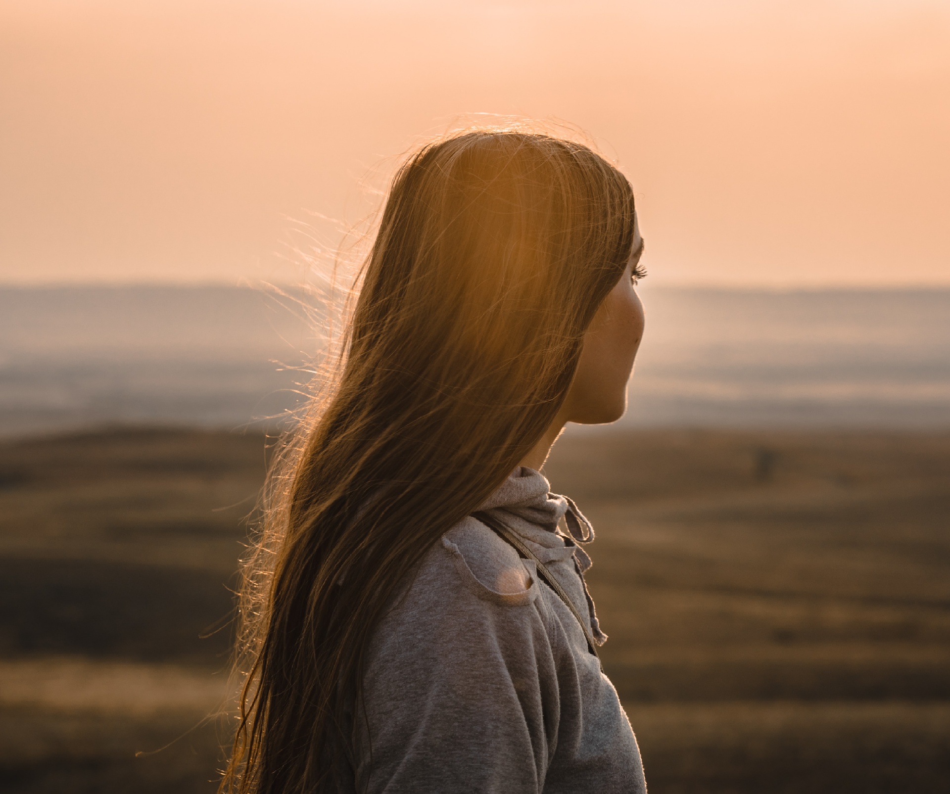 Photo of a teen girl staring at the beach during sunset. Do you think your teen might have ADHD? With teen therapy in Marin County, CA your teen can learn the coping skills needed to manage their ADHD.
