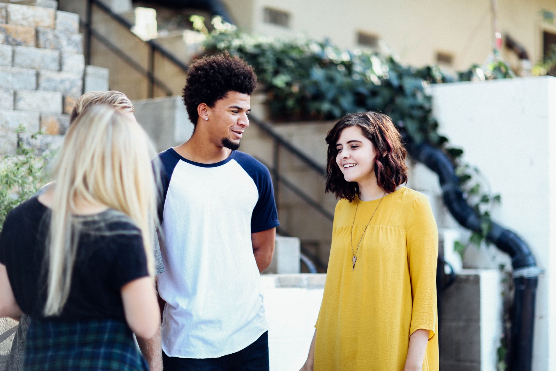 Photo of four teens standing outside talking to each other. Is your teen struggling with ADHD? Learn how teen therapy in Marin County, CA can help your teen manage their ADHD symptoms.