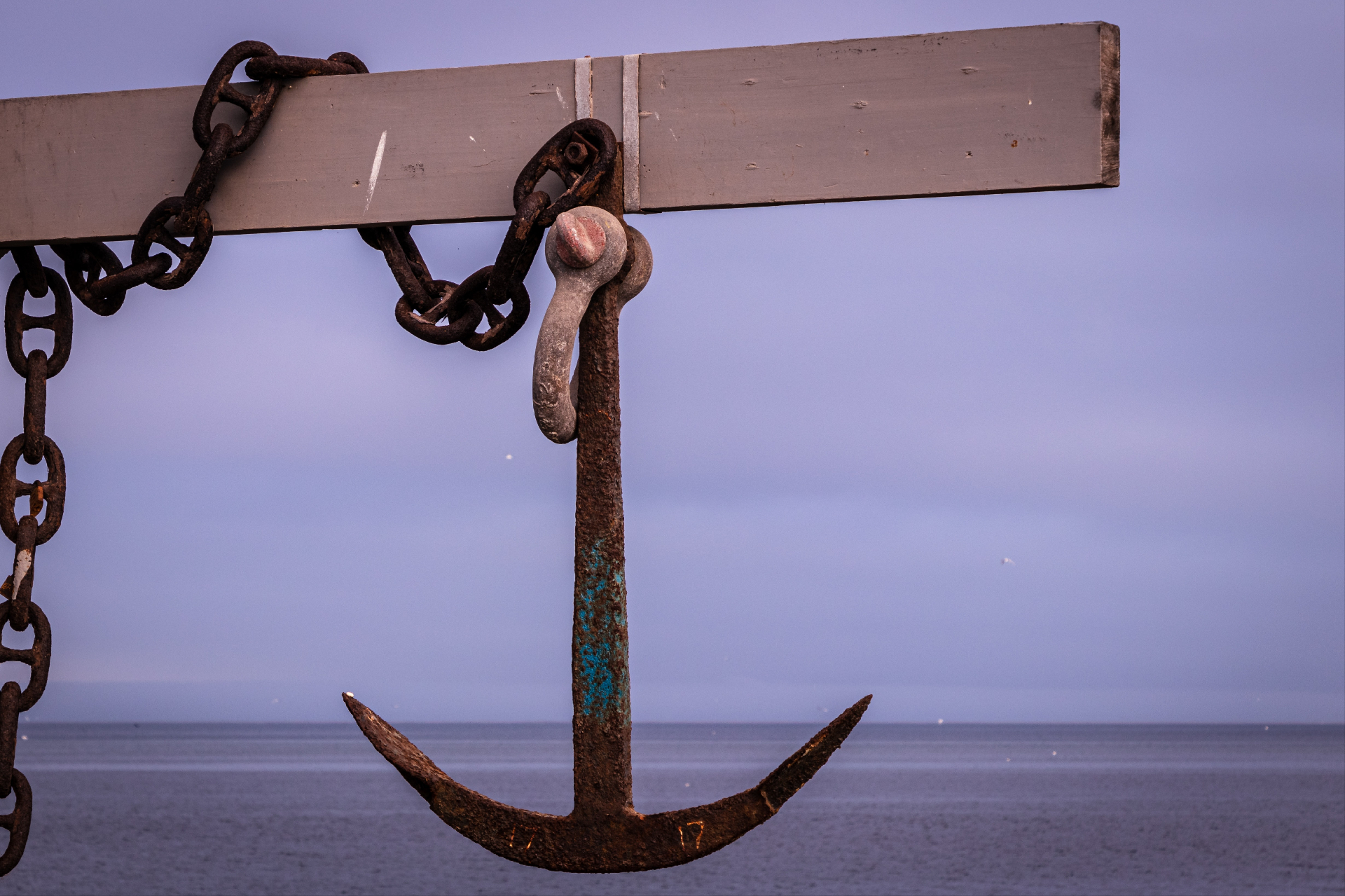 Photo of an anchor and chain hanging on a board on the beach. Anxiety can be stressful and overwhelming. Learn from an anxiety therapist in Marin County, CA how you can overcome your anxiety symptoms.