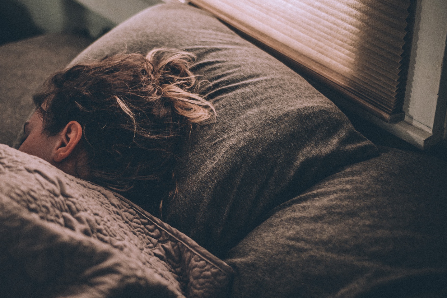Photo of a woman laying in bed representing how anxiety can keep you from leaving your house. With anxiety therapy in San Franciso, CA you can begin taking back control of your life.